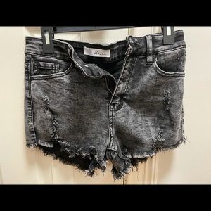 Black distressed Kancan Jean shorts.
